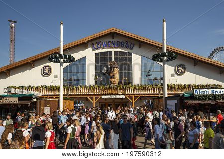 Munich, Germany - September 24, 2016: Facade and entrance of the Loewenbraeu beer tent with people standing in front