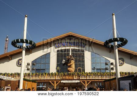 Munich, Germany - September 24, 2016: Facade and entrance of the Loewenbraeu beer tent with people standing in front