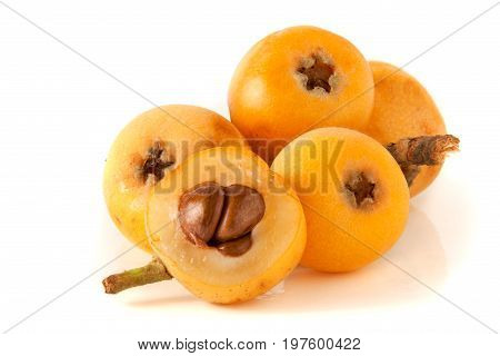 Ripe loquat or Eriobotrya japonica with leaf isolated on white background.