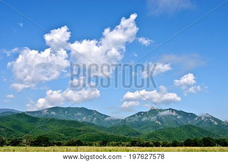 Mountains, clouds and meadow beautiful view landscape