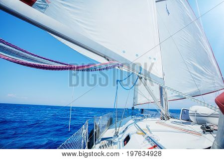 View of the prow of a yacht and the boom