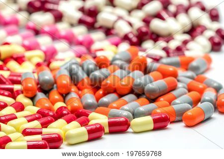 Colorful of antibiotic capsules pills on white background drug resistance