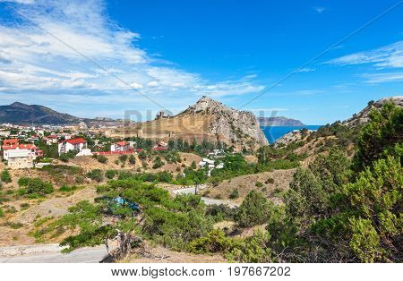 View of the resort town of Sudak on the coast of the Black sea from Genoese fortress on the mountain Cenevez Qaya