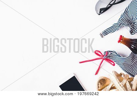 Retro Style Striped Swimsuit And Fashion Accessories  On A White Concrete Background