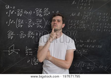 Young Student Is Thinking And Solving Mathematical Problem. Math