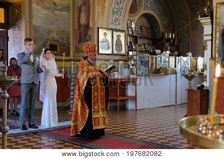 Alchevsk, Ukraine - April 28, 2017: Wedding Ceremony For Newlyweds In The Church
