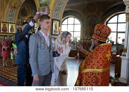 Alchevsk, Ukraine - April 28, 2017: Wedding Ceremony For Newlyweds In The Church