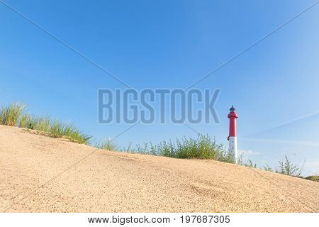 Lighthouse red and white at the French west beach