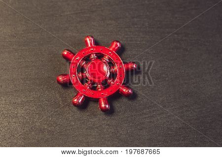 Famous Fidget Spinner Stress Relieving N A Black Wooden Background