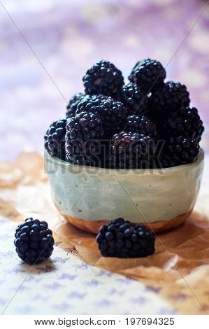 Homemade, sweet, delicious blackberries in a handmade dish