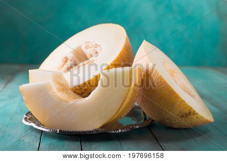 Fresh Sweet Orange Melon On The Wooden Table, Selective Focus And Toned Image
