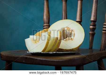 Fresh Sweet Orange Melon On The Wooden Table, Selective Focus And Toned Image
