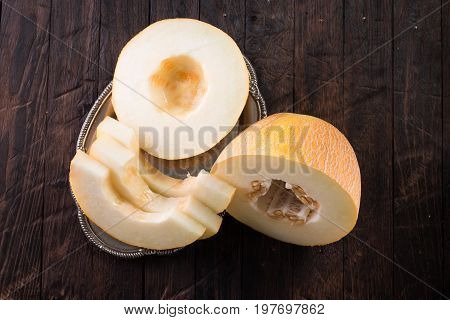 Fresh Sweet Orange Melon On The Wooden Table, Selective Focus And Toned Image