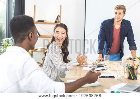 Multiethinc Business Coworkers Having Conversation During Conference In Office