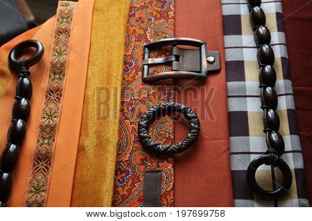 Different textures. Bright fabrics collection. Orange sewing