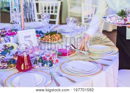 Serving a wedding dinner. Catering service concept