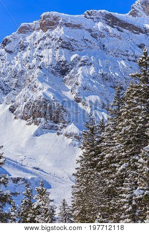 Wintertime view on Mt. Titlis in Switzerland. The Titlis is a mountain, located on the border between the Swiss cantons of Obwalden and Bern.