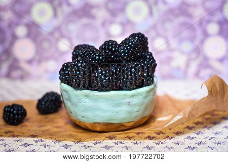 Homemade, sweet, delicious blackberries in a handmade dish