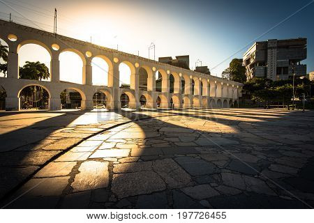 Beautiful View of Sun Shining Through Landmark Lapa Arch in Rio de Janeiro City Downtown.