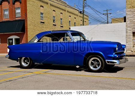 CASSELTON, NORTH DAKOTA, July 27, 2017: The annual Casselton Car Show which occurs the last Thursday of July features classic vehicles such as the refurbished 1954 two door Ford Skyliner