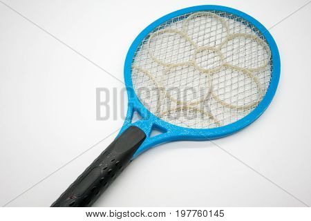 Blue plastic mosquito racket killer with electric net and flower pattern on flat surface for sparking. Electric insect bug swatter rechargeable battery.