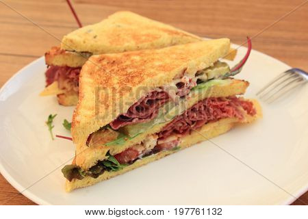 A fresh pastrami sandwich: charcuterie lettuce pickles and mayonaisse