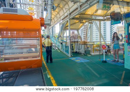 OSAKA, JAPAN - JULY 18, 2017: Close up of Tempozan Ferris Wheel in Osaka, Japan. The wheel has a height of 112.5 metres, it's opened in 1997, situated in Tempozan Harbor Village.
