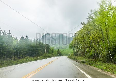 Highway Road In Stormy Misty And Foggy Weather In Mountain Charlevoix Region Of Quebec, Canada