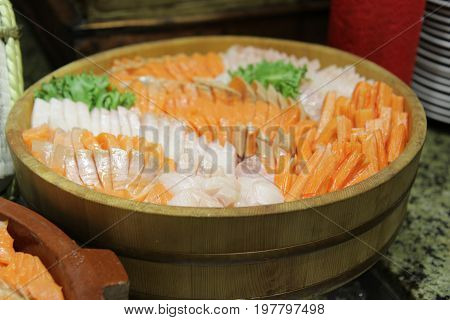 Japanese assorted tasty fresh sashimi set on tray many delicious colorful rolls.Selective focus