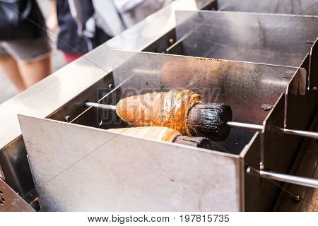 Trdelnik - traditional Czech hot sweet pastry sold in the streets of Prague