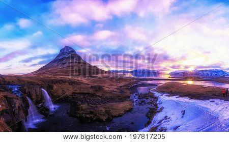Spring Sunrise Over The Famous Kirkjufellsfoss Waterfall With Kirkjufell Mountain In The Background