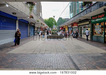 Poplar London UK - July 16 2017: Vesey Path Chrisp Street on a Sunday with shoppers. Area looking run down.