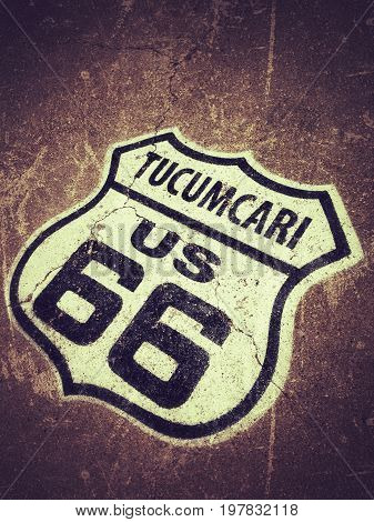 Route 66 sign painted on the road in Tucumcari