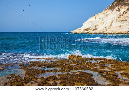 Rocks of white limestone on the Mediterranean Sea. Geological phenomenon in the north of Israel. The grottoes of Rosh Ha Nikra