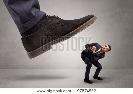 Young businessman illustrated inconsiderable by being trampled