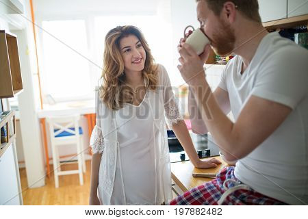 Romantic couple in love speding time together in kitchen
