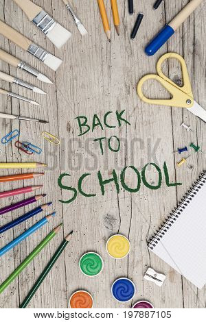School Accessories On A Wooden Background