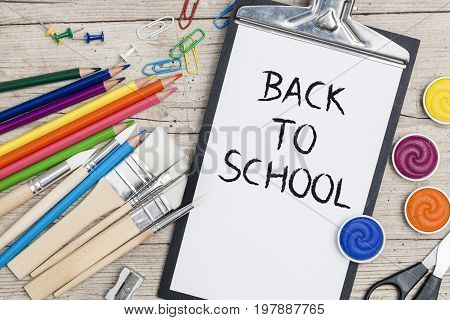 School Accessories On A Wooden Background