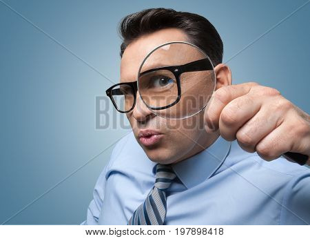 Glass business holding man magnifying magnifying glass money