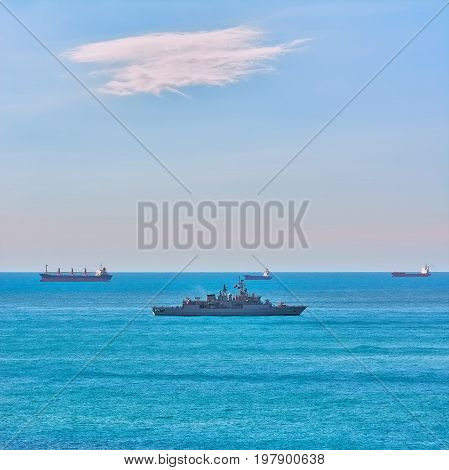 Military Frigate near Cargo Ships in the Black Sea