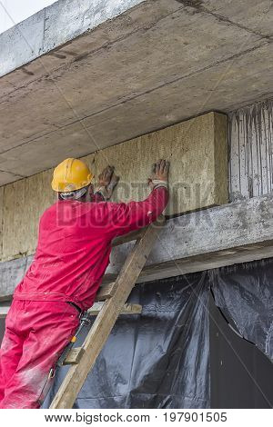 Man Installing External Wall Insulation 3