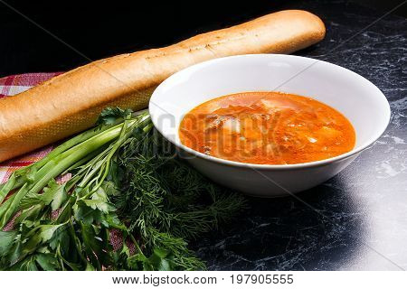 Vegetables And Meat In Red Beetroot Soup Or Borsch In White Plate On Dark Marble Background.