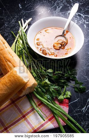Vegetables And Meat In Red Beetroot Soup Or Borsch In White Plate With Metal Spoon In It On Dark Mar