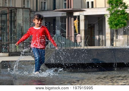 Ostrava Czech Republic 15 May 2015 Editorial photo of gipsy young girl which is running through fountain Ostrava Czech Republic