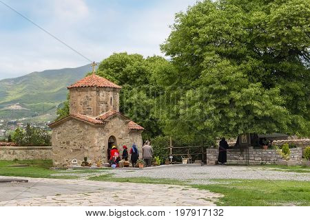 Mtskheta, Georgia - 8 October, 2016: Samtavro Monastery, small chapel and people