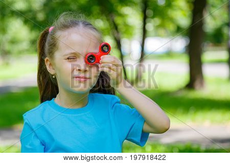 Little Girl Playing With Fidget Spinner