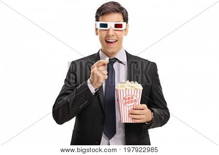 Businessman wearing a pair of 3D glasses and having popcorn isolated on white background