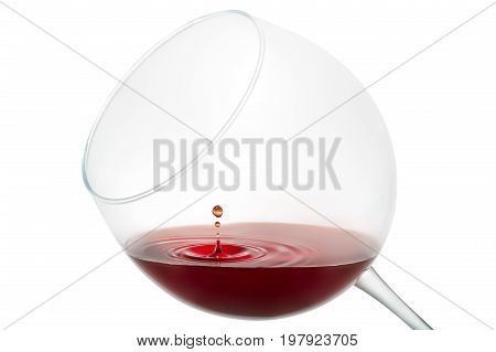 Wine drop splashing on glass isolated on white background