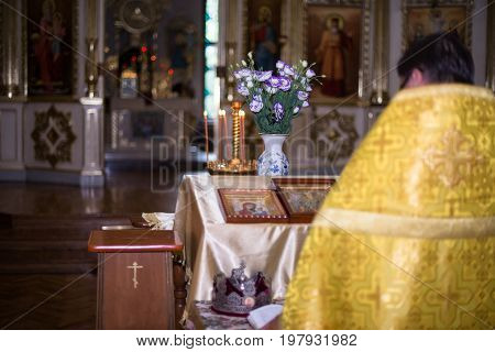 the priest standing with his back to the altar in the temple Orthodox Church.