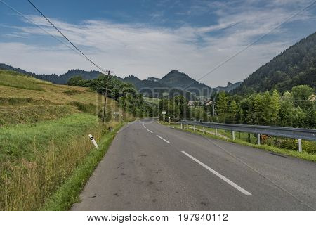 Road near Lesnica village in Pieniny national park in cold summer morning